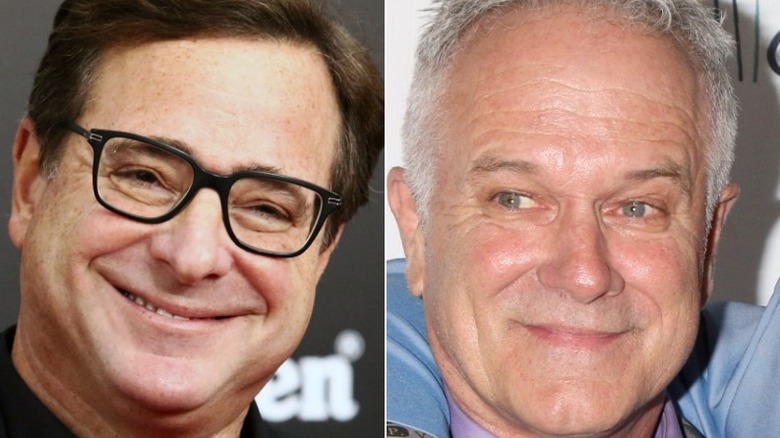 Bob Saget smiles with a tilted head and John Posey smiles while looking left