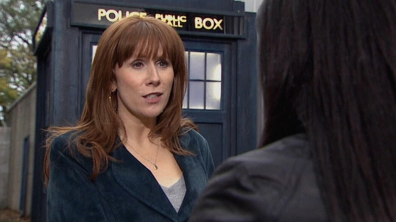 Donna in front of the TARDIS