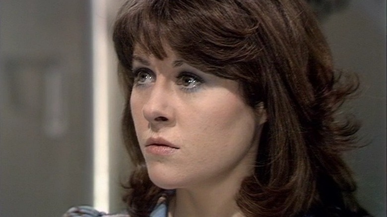 Sarah Jane looks left