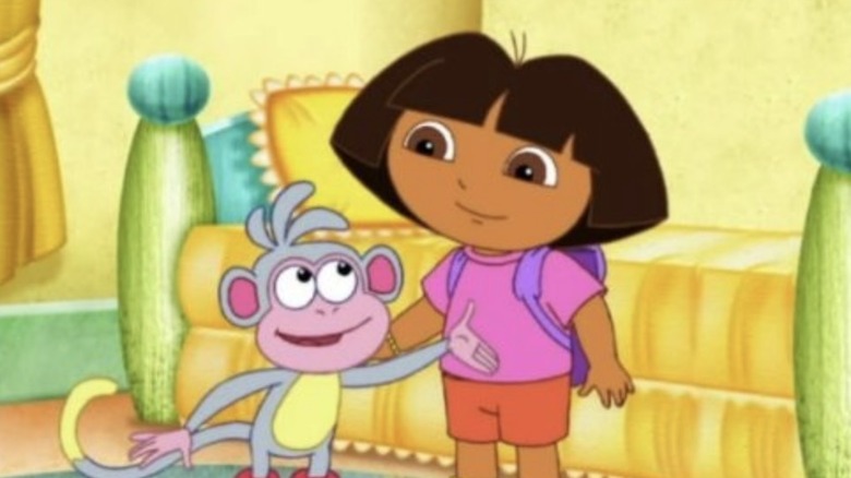 Dora standing with Boots