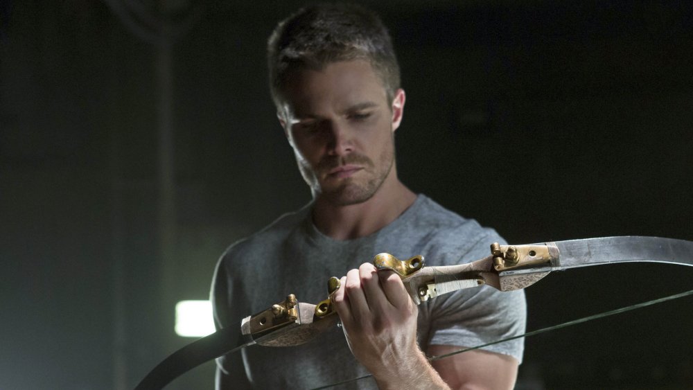 Stephen Amell as Oliver Queen, AKA Green Arrow, on Arrow