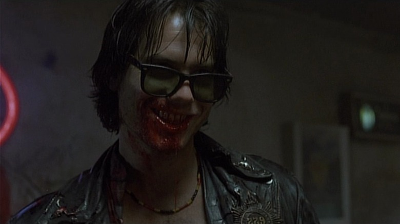 Bill Paxton grinning after a grisly encounter