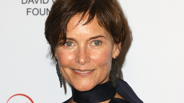 Carey Lowell smiles