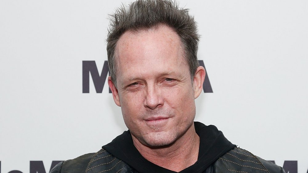 Dean Winters smirking