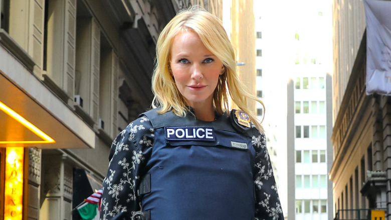 Kelli Giddish wears a police vest