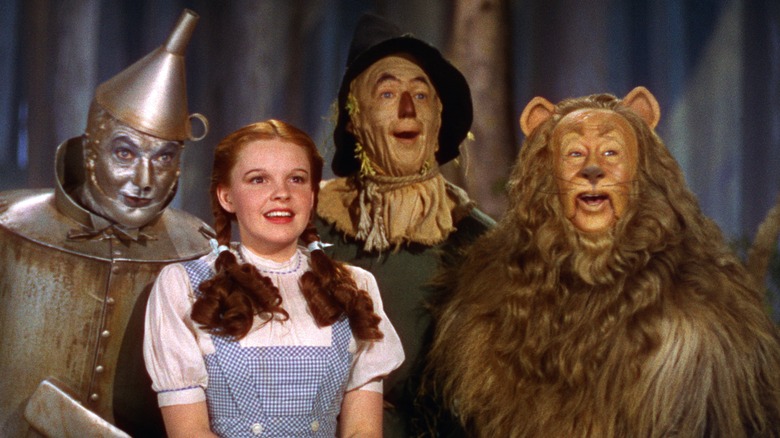 Dorothy and friends smiling excitedly