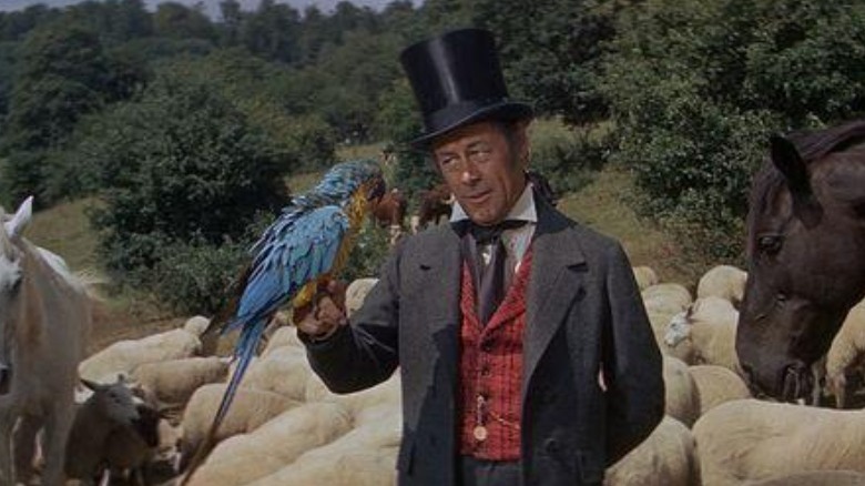 Rex Harrison being friendly to a seal Doctor Dolittle