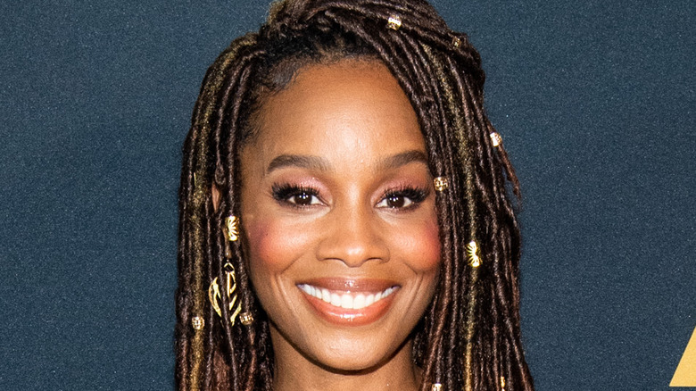 Anika Noni Rose smiling at a red carpet event