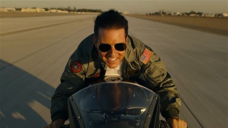 Tom Cruise riding a motorcycle in Top Gun: Maverick