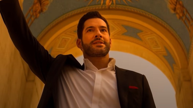 Tom Ellis' Lucifer holding up arm