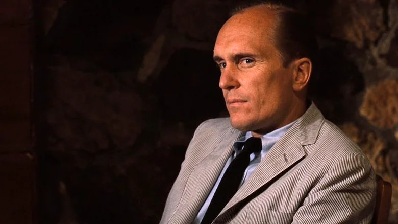 Tom Hagen looking on seriously