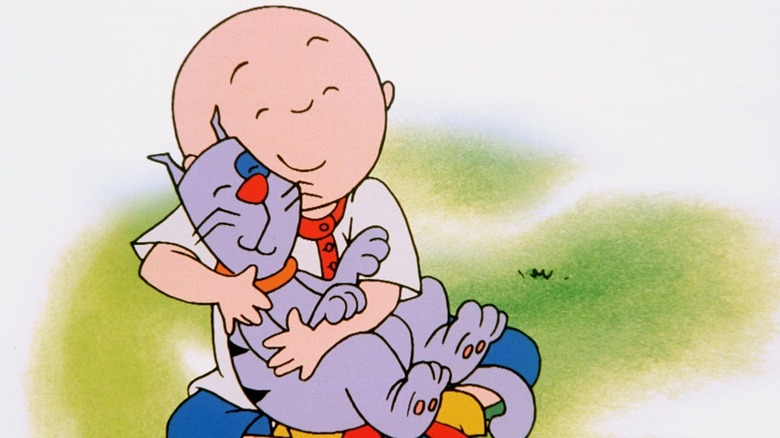 Caillou holding his cat