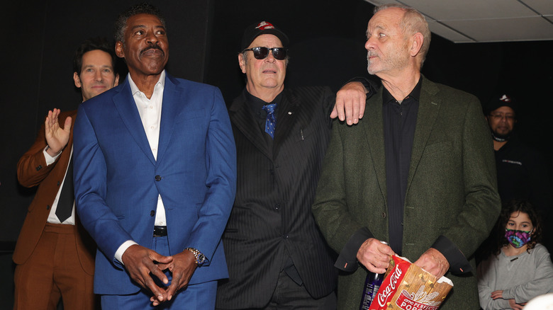 Ernie Hudson, Dan Aykroyd, Bill Murray standing together