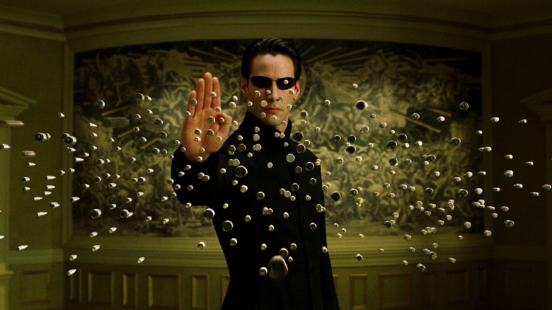 Neo facing down multiple bullets