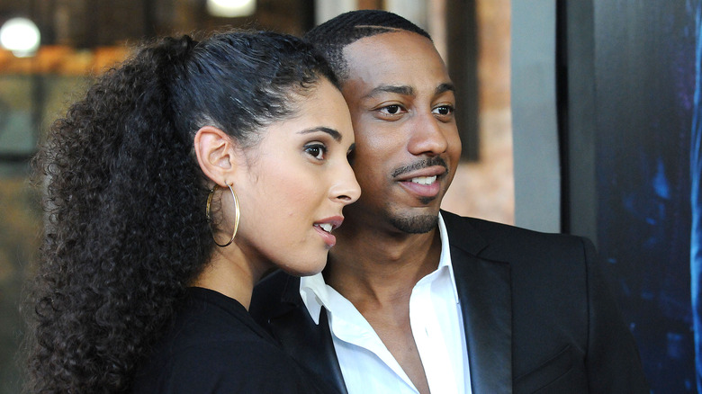 Denise Xavier and Brandon T. Jackson embracing