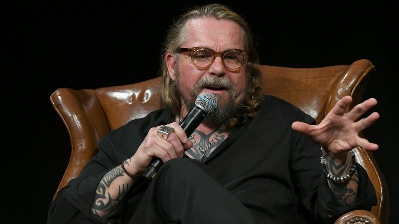 Kurt Sutter speaks into a microphone