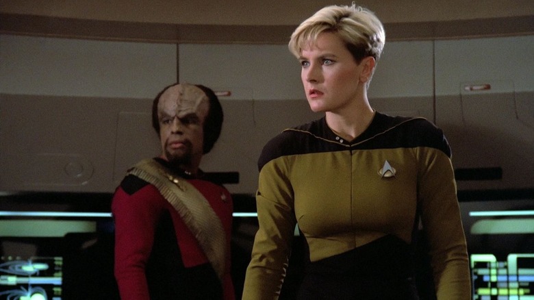 Natasha Yar and Worf looking sideways