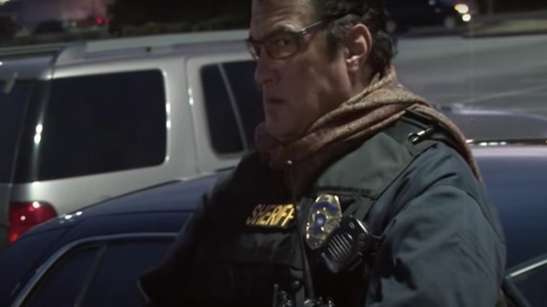 Steven Seagal wearing flak jacket