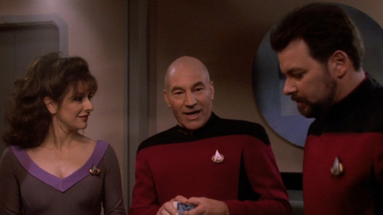 Deanna Troi, Jean-Luc Picard, and William Riker talking