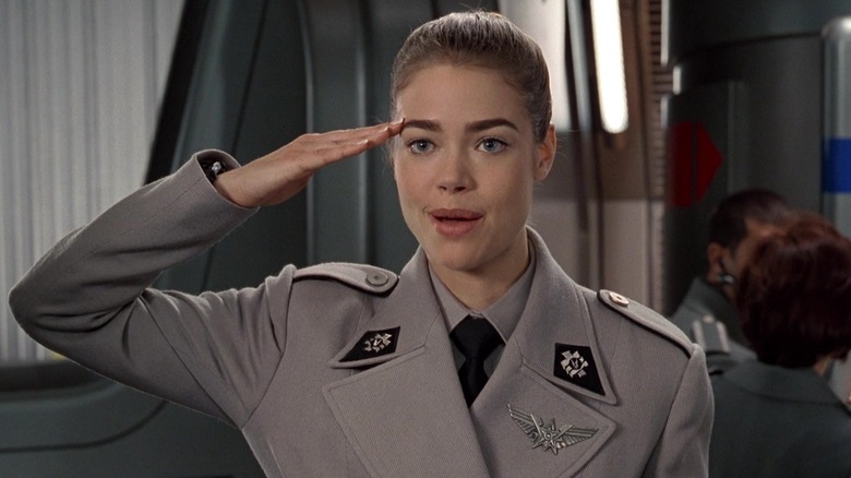 Captain Carmen saluting wearing uniform