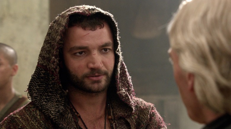 Ashur wearing a cloak