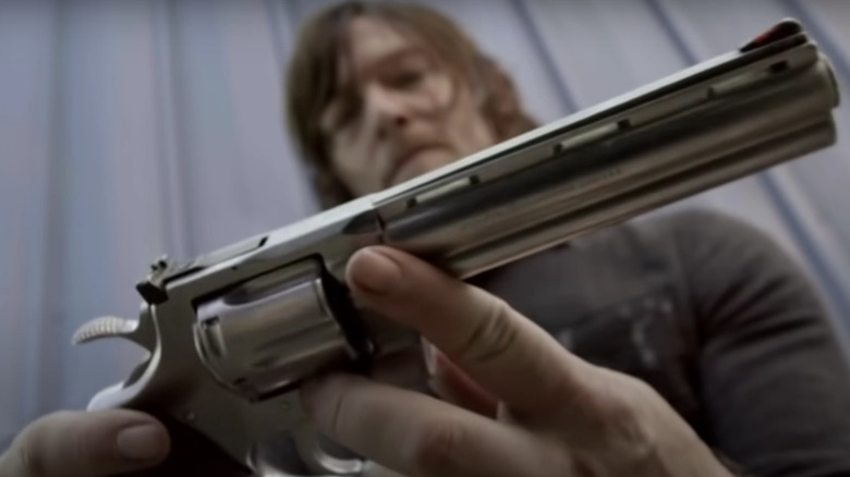 Daryl brandishes Rick's gun