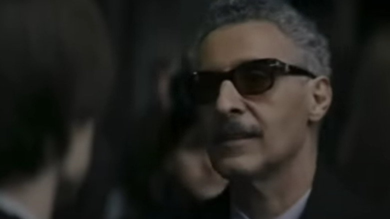 Carmine Falcone wearing sunglasses