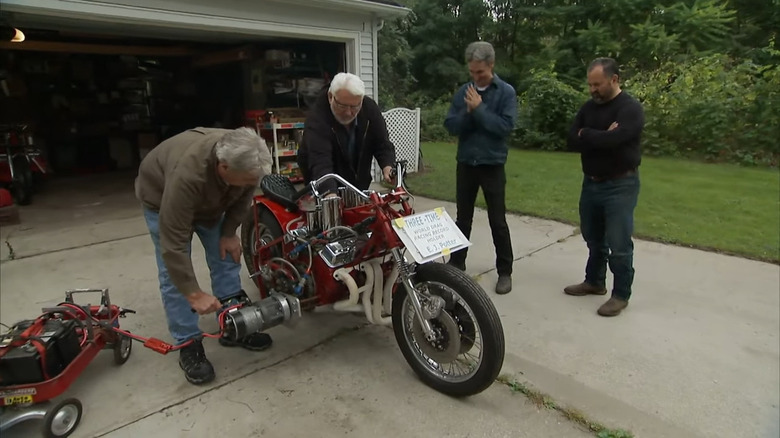 Mike Wolfe checking out a bike