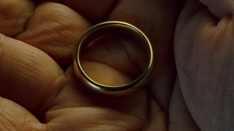 Bilbo holding the One Ring