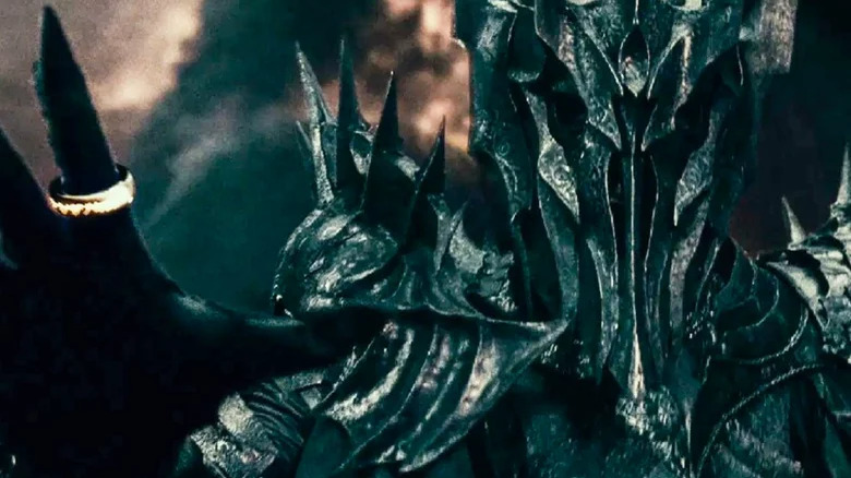 Sauron holding up hand