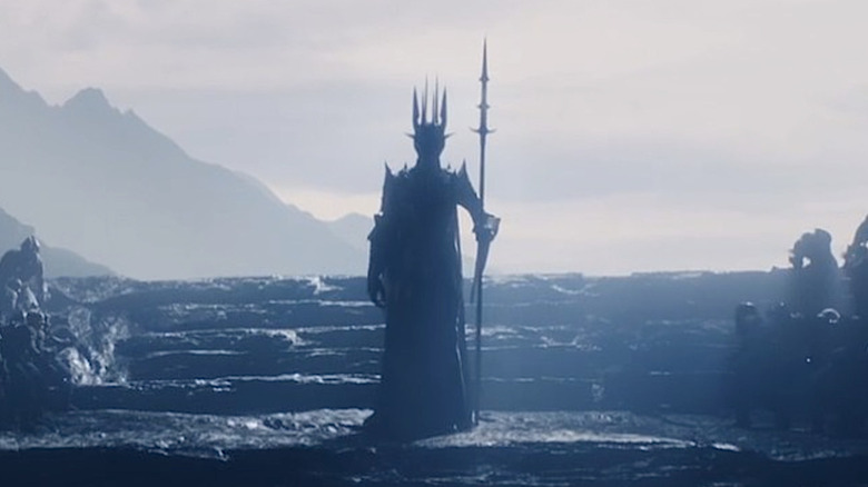 Sauron surrounded by Orcs