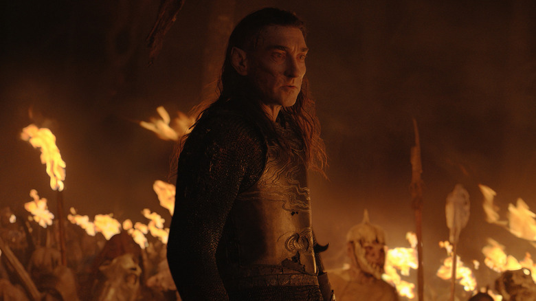 Joseph Mawle standing in fire