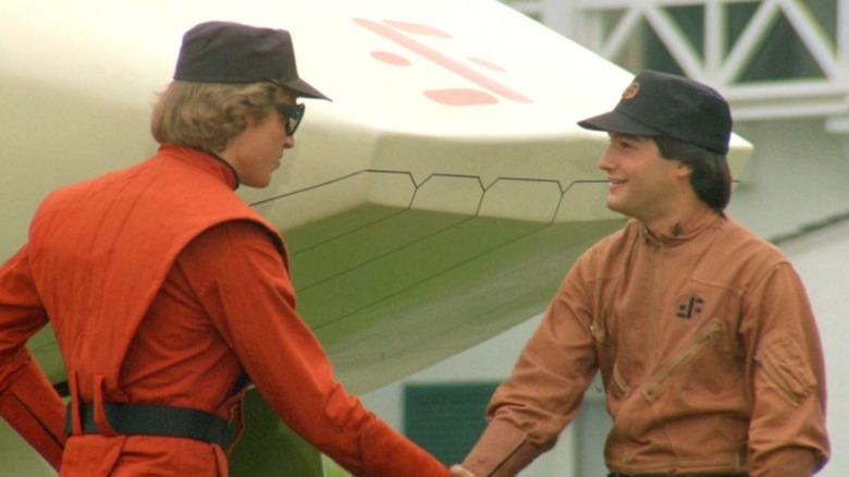 Visitor shaking hands with human