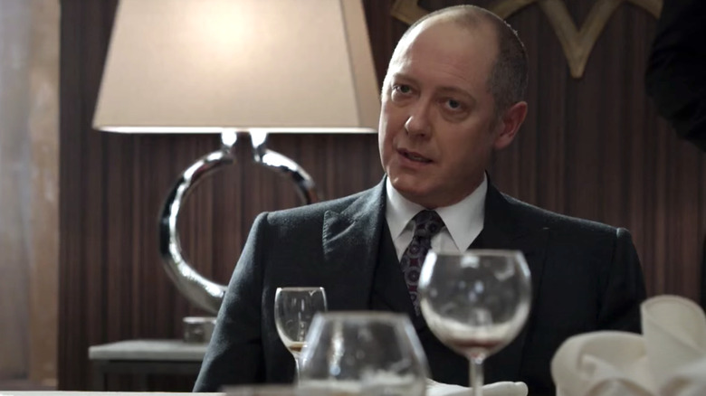 Raymond Reddington sitting at dinner table