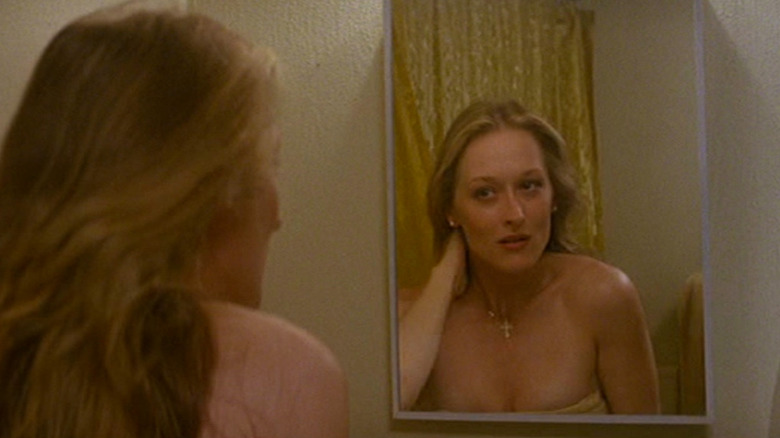 Meryl Streep looking at herself in mirror