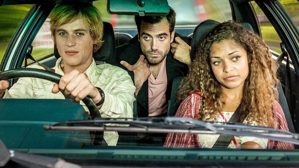 Dylan, Luke, and Evie in a car