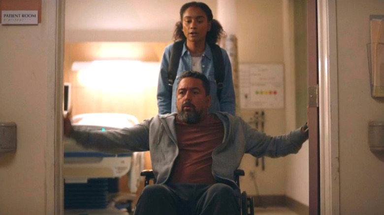 Elena Flores helping Matthew Garza in a wheelchair