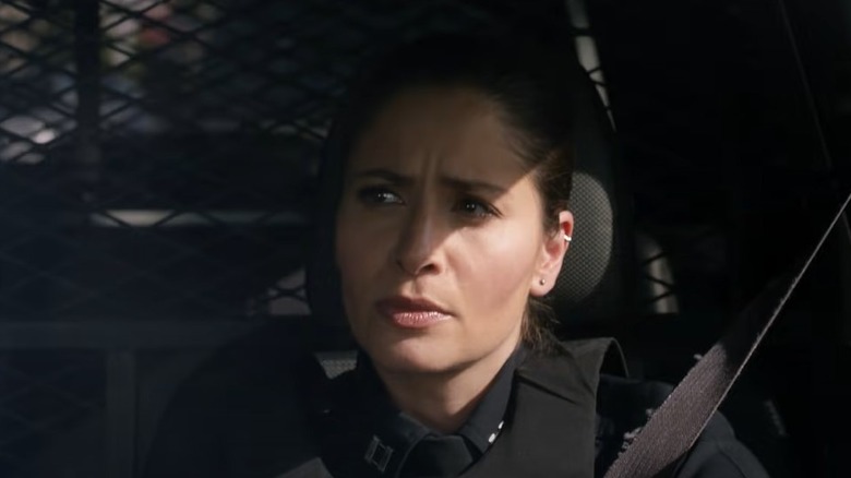 Mercedes Mason checking her rearview