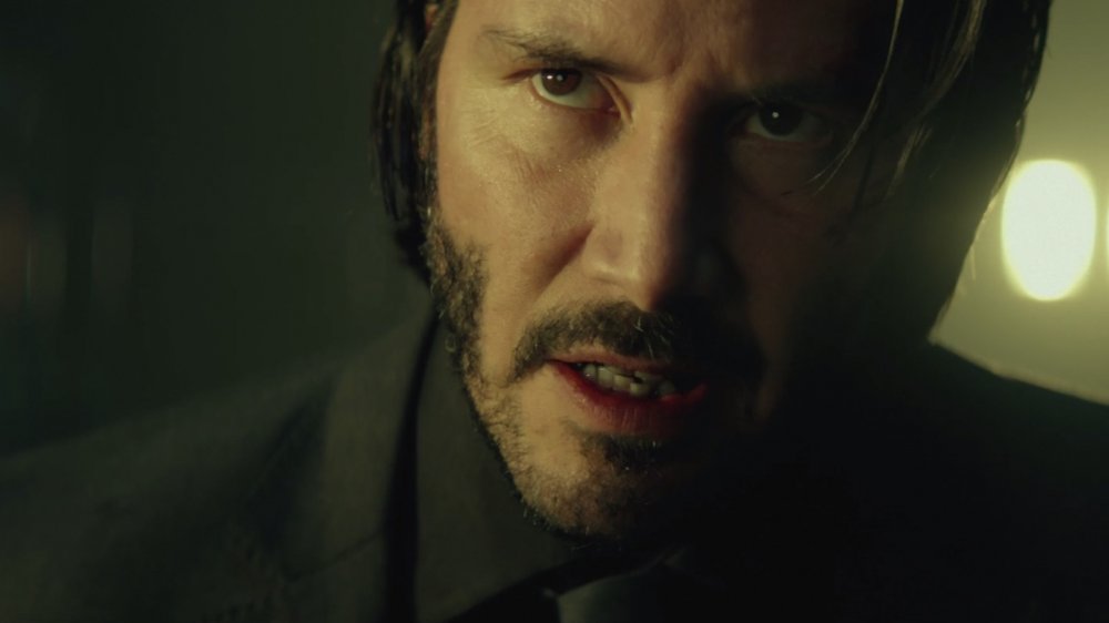 John Wick stares down his captors -- yeah, he's thinking he's back