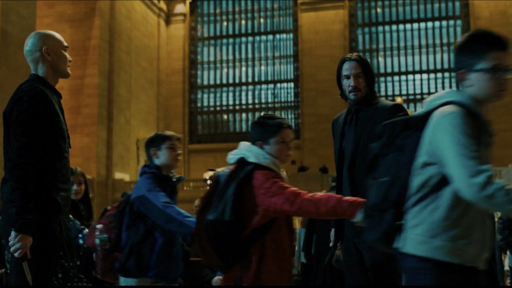 An encounter between John Wick and Zero is interrupted by a train of school children