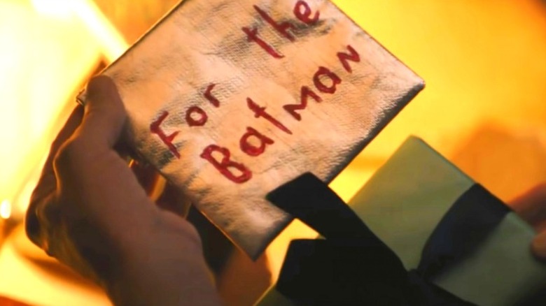 Alfred opening a message for Batman