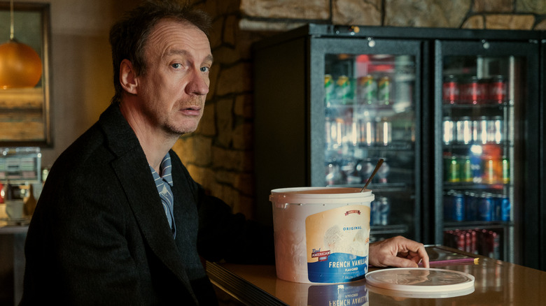 David Thewlis as John staring to the side