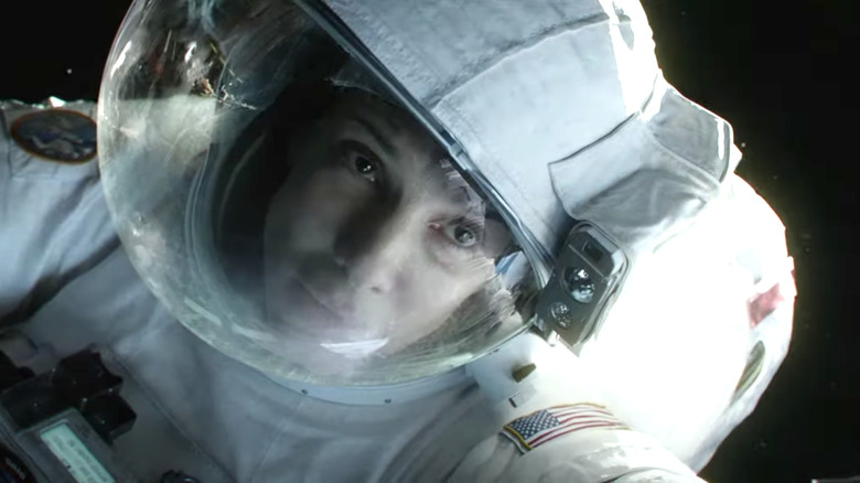 Sandra Bullock wearing astronaut suit