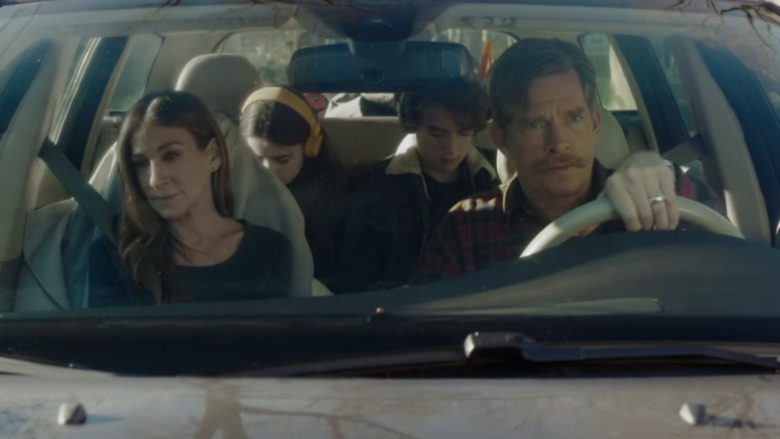 Frances and Robert in car with kids