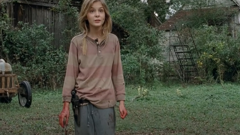 Lizzie Samuels holds bloody knife