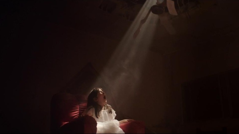 Under the Shadow horror film light bomb girl