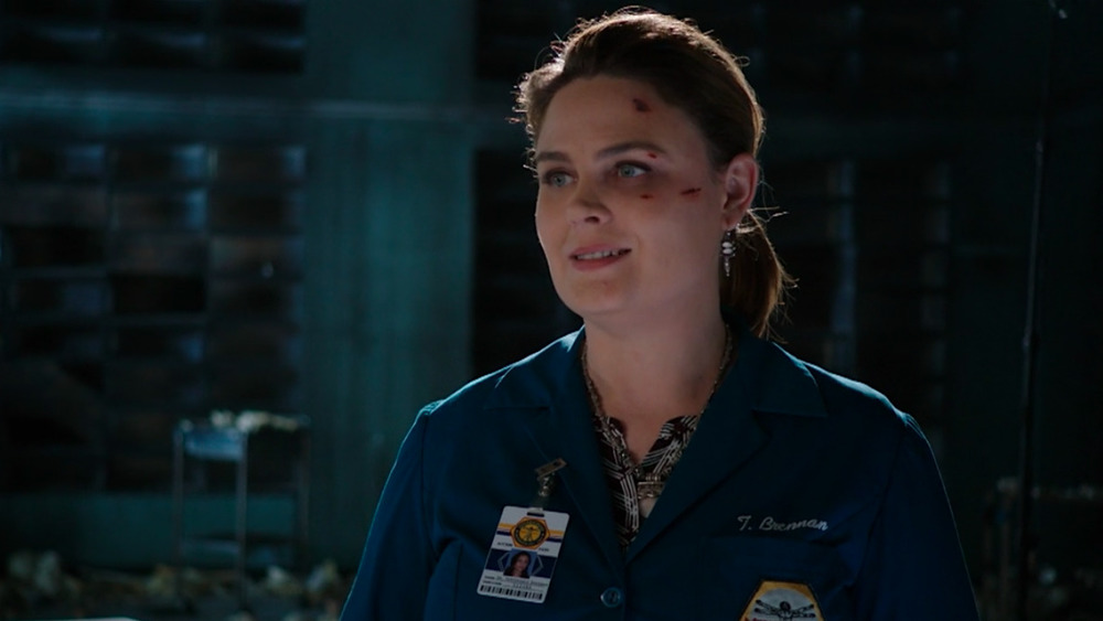 Emily Deschanel smiling with blood on face