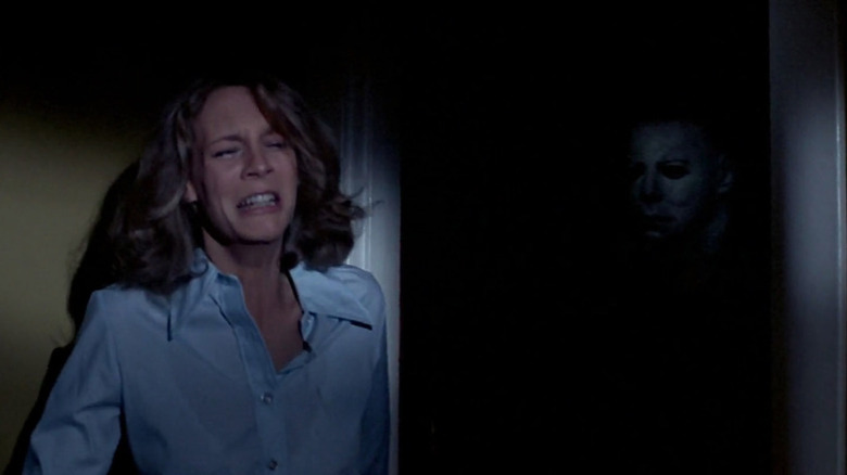 Laurie cries and hides from Michael Myers