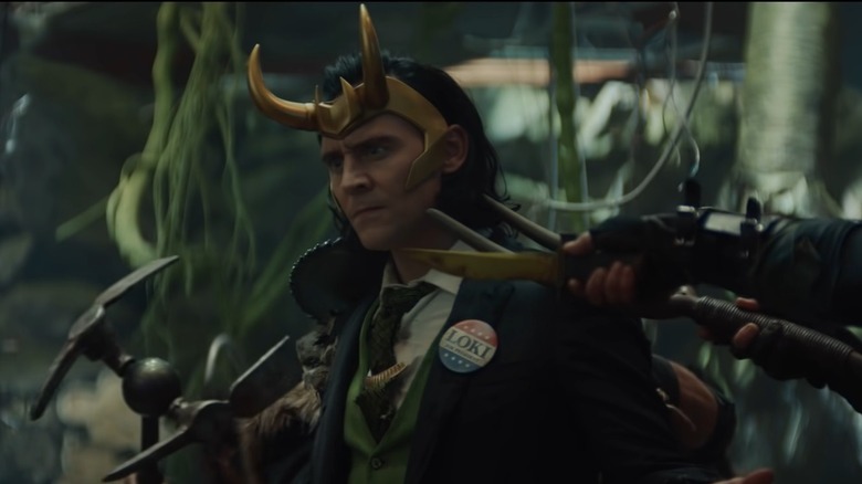 Loki confused and surrounded by weapons