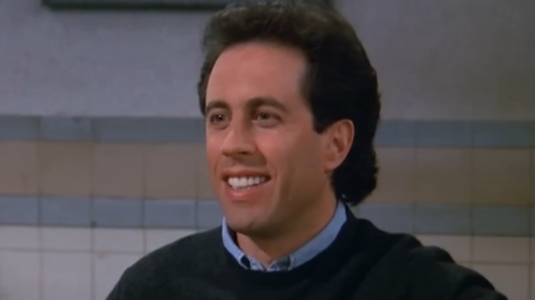 Jerry Seinfeld smiling at diner